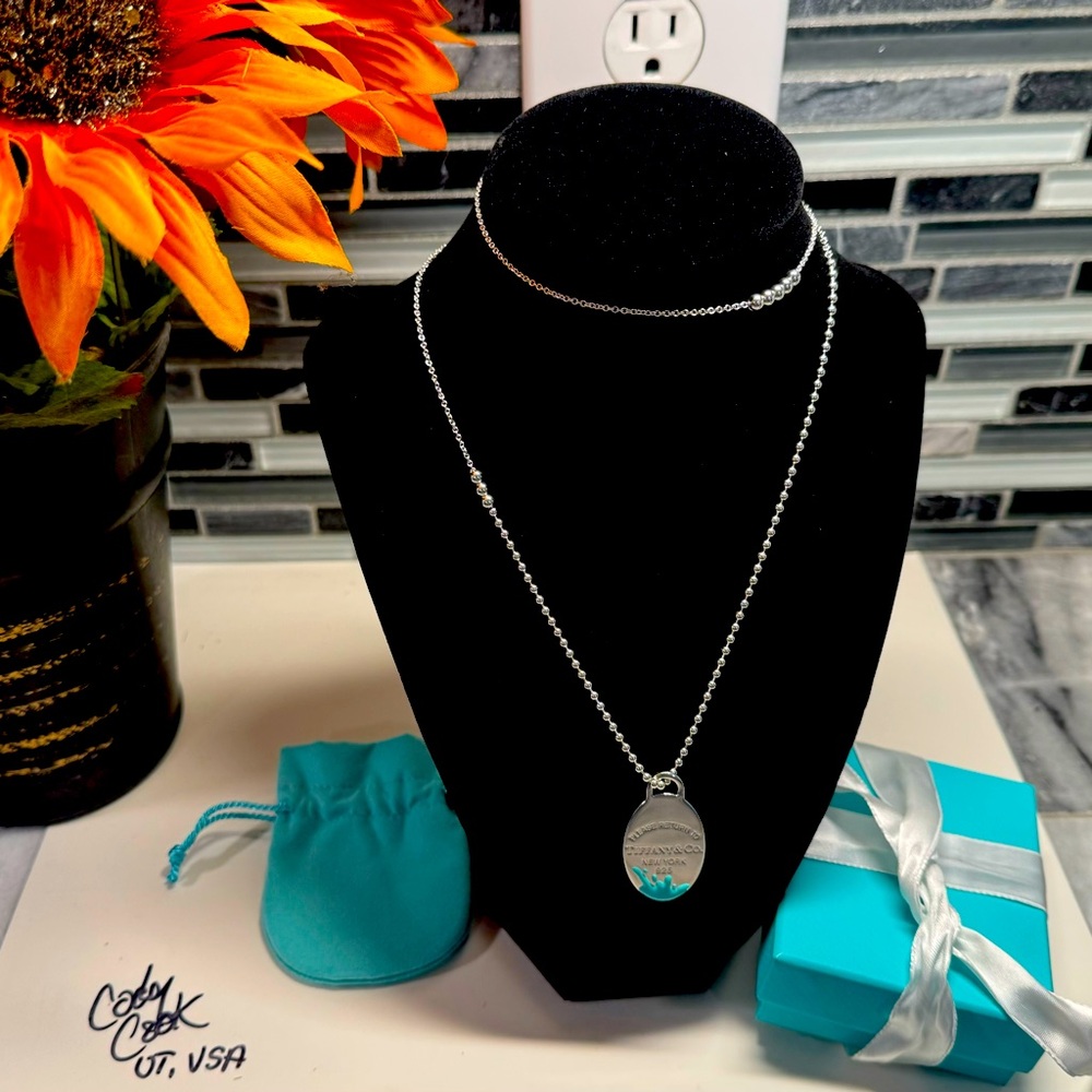 Tiffany & Co Blue oval splash enamel pendant with gorgeous Tiffany chain.